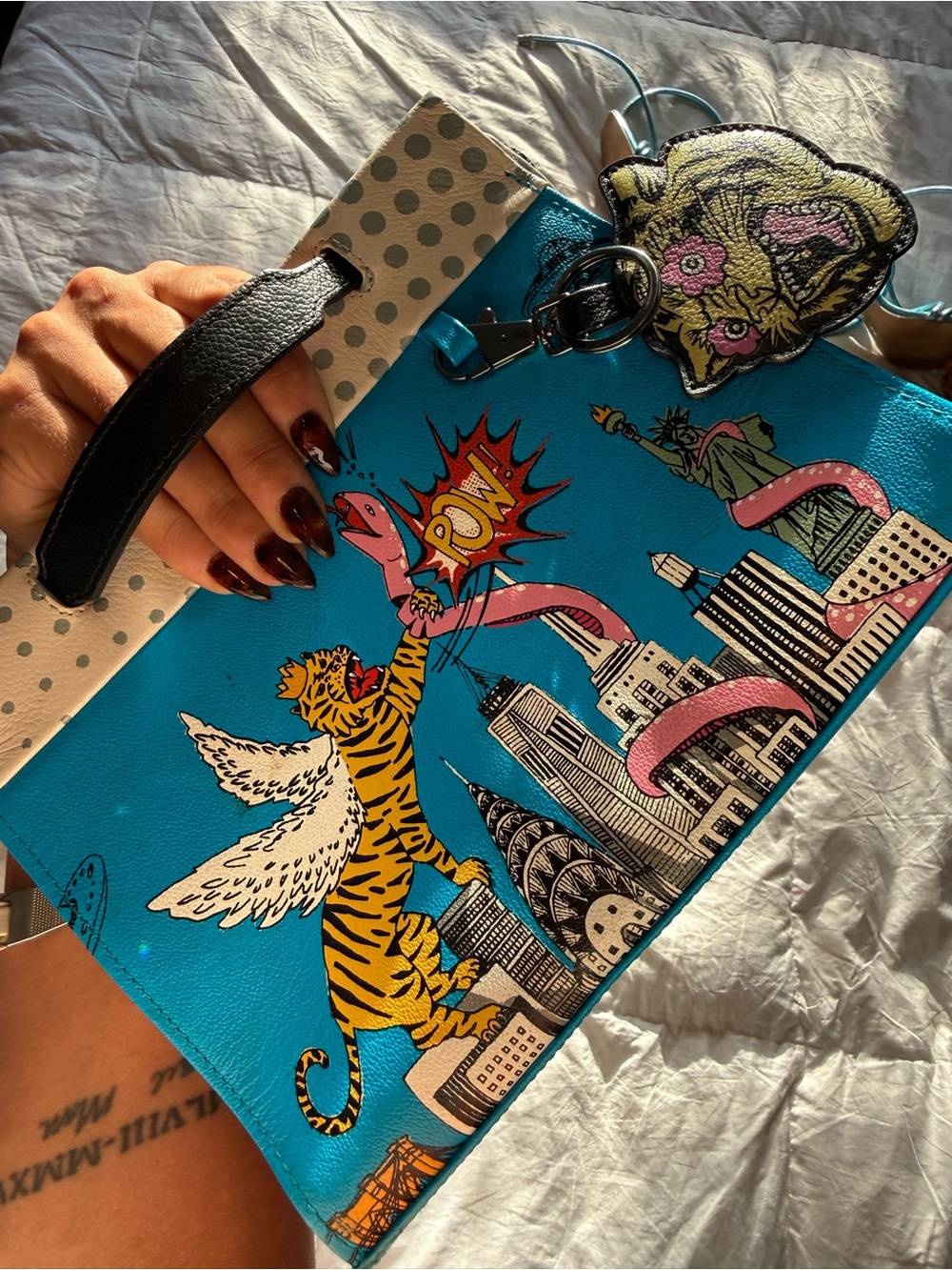 Min & Mon Turquoise Graphic Winged Tiger Wristlet Clutch